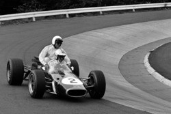 Denny Hulme gives a lift to Jack Brabham