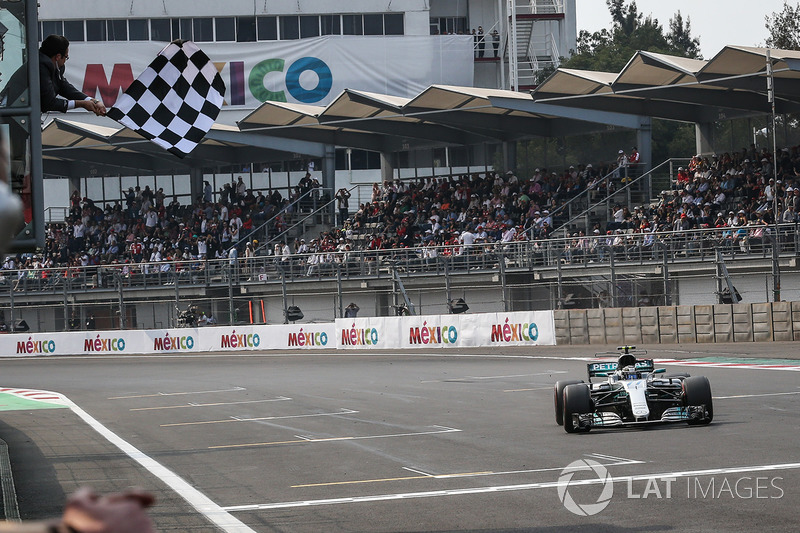 Valtteri Bottas, Mercedes-Benz F1 W08 crosses the line to take the chequered flag and second place