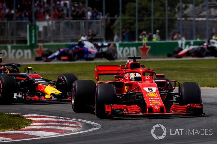 Sebastian Vettel, Ferrari SF71H, leads Max Verstappen, Red Bull Racing RB14