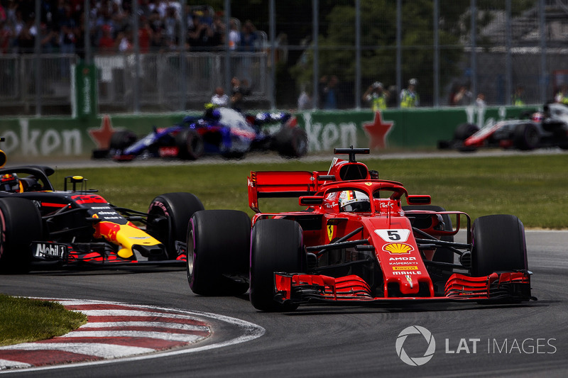 Sebastian Vettel, Ferrari SF71H, leads Max Verstappen, Red Bull Racing RB14