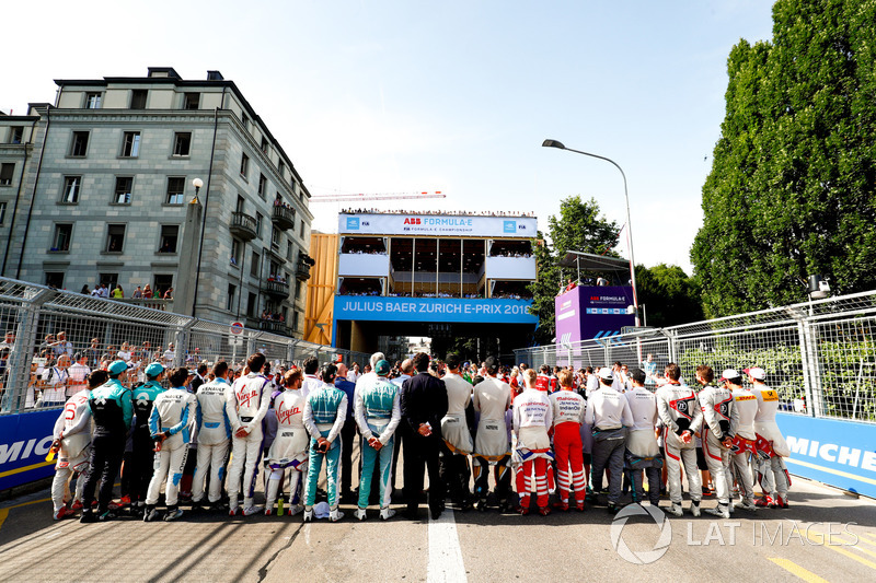 Drivers line up on the grid