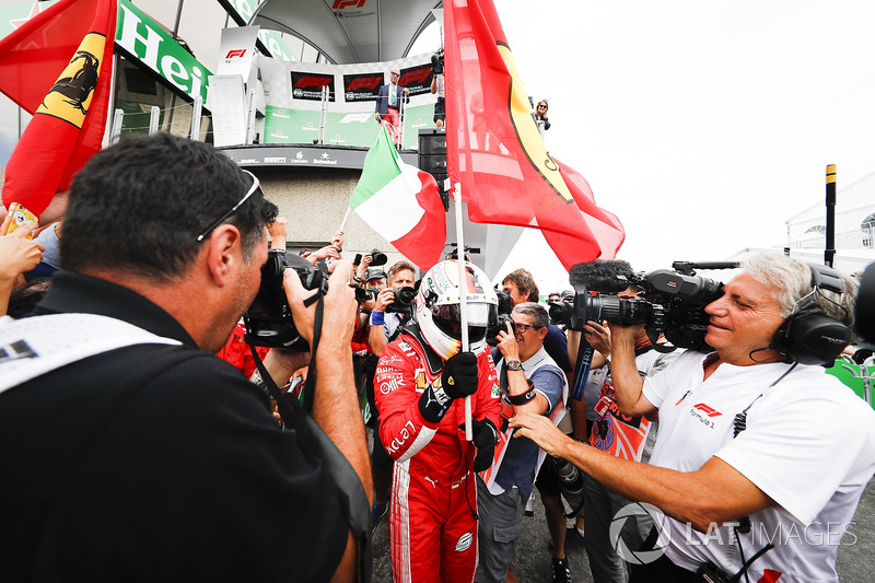 Sebastian Vettel, Ferrari, 1st position, celebrates with his team on arrival in Parc Ferme