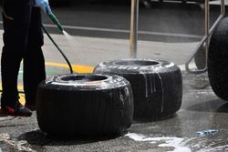 Red Bull Racing mechanic washes Pirelli tyres