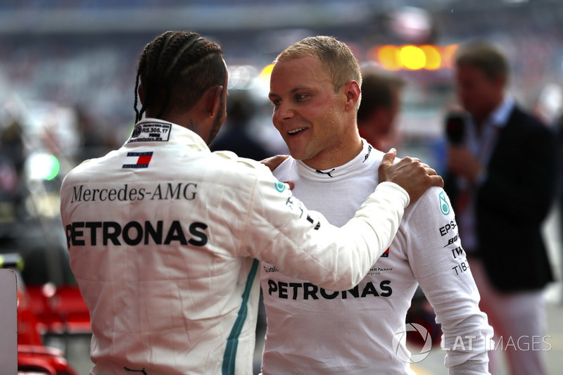 Lewis Hamilton, Mercedes AMG F1, celebrates victory in parc ferme, with Valtteri Bottas, Mercedes AMG F1