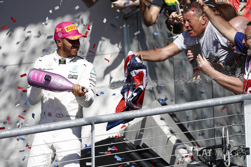 Race winner Lewis Hamilton, Mercedes AMG F1, sprays the victory Champagne