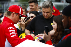Kimi Raikkonen, Ferrari, signs autographs for fans