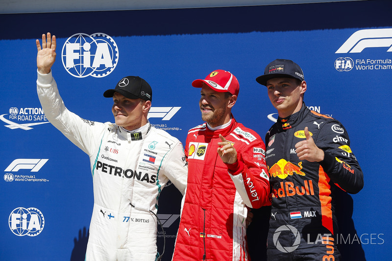 Sebastian Vettel, Ferrari, celebrates pole position ahead of Valtteri Bottas, Mercedes AMG F1 and Ma