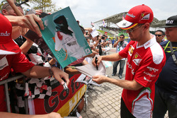Sebastian Vettel, Ferrari signs autographs for the fans