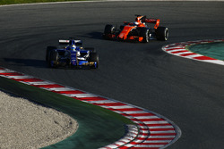 Marcus Ericsson, Sauber C36, leads Fernando Alonso, McLaren MCL32