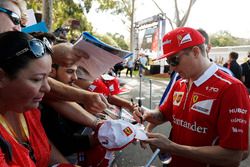 Kimi Raikkonen, Ferrari, signs autographs for fans