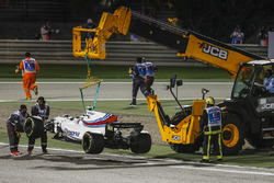 Marshals remove the car of Lance Stroll, Williams FW40
