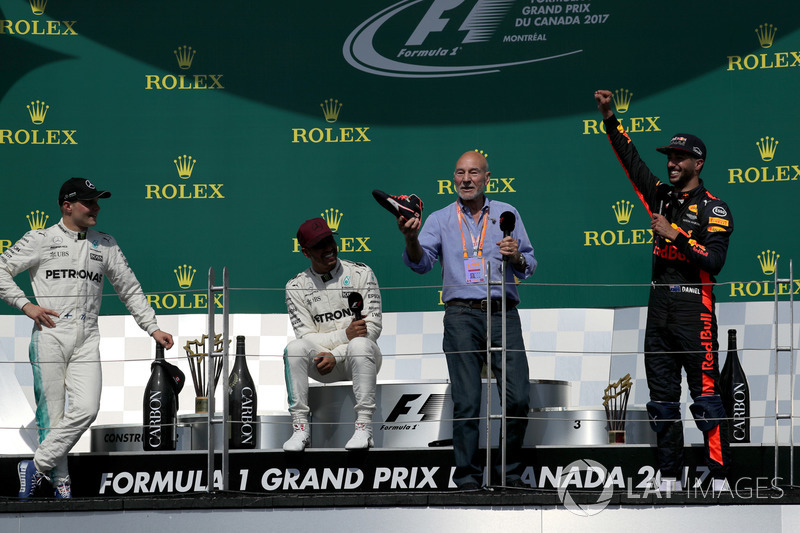Patrick Stewart, Actor celebrates and drinks from the boot of Daniel Ricciardo, Red Bull Racing alongside Race winner Lewis Hamilton, Mercedes AMG F1 and Valtteri Bottas, Mercedes AMG F1 on the podium