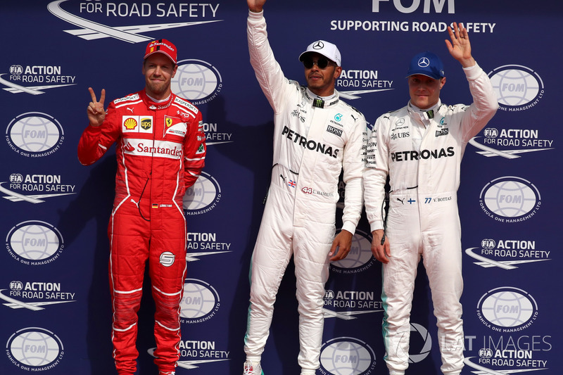 Polesitter Lewis Hamilton, Mercedes AMG F1 celebrates in parc ferme, Sebastian Vettel, Ferrari and Valtteri Bottas, Mercedes AMG F1