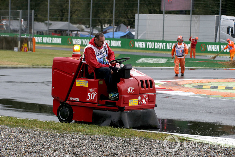 Marshal removes water from the track