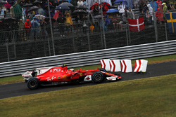 Kimi Raikkonen, Ferrari SF70H runs wide into the bollards