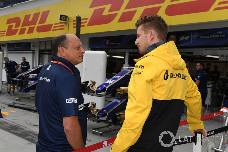 Nico Hulkenberg, Renault Sport F1 Team RS17 with Frederic Vasseur, Renault Sport F1 Team RS17 Racing Director