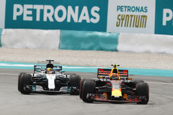 Max Verstappen, Red Bull Racing RB13, passes Lewis Hamilton, Mercedes AMG F1 W08 for the lead