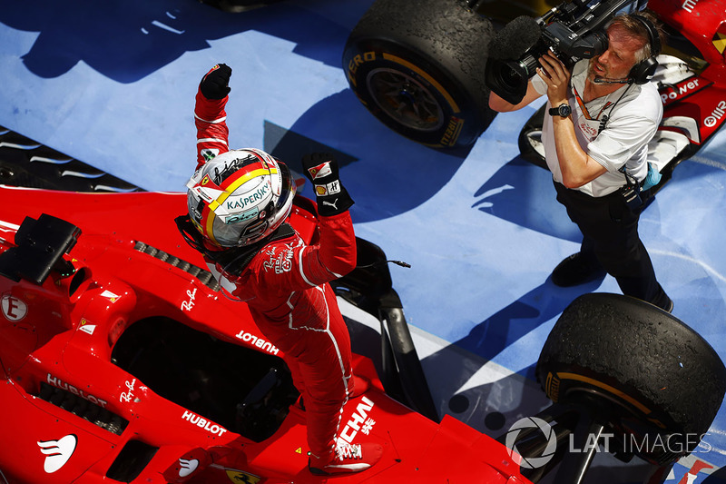 Sebastian Vettel, Ferrari, is filmed celebrating victory in parc ferme