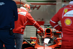 Sebastian Vettel, Ferrari looks at Ferrari SF70-H with cockpit shield