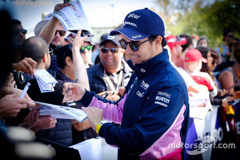 Sergio Perez, Racing Point signs autographs for fans