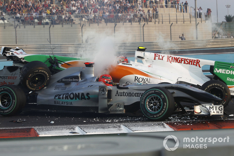 Michael Schumacher, Mercedes GP MGP W01 spins and collects Vitantonio Liuzzi, Force India VJM03