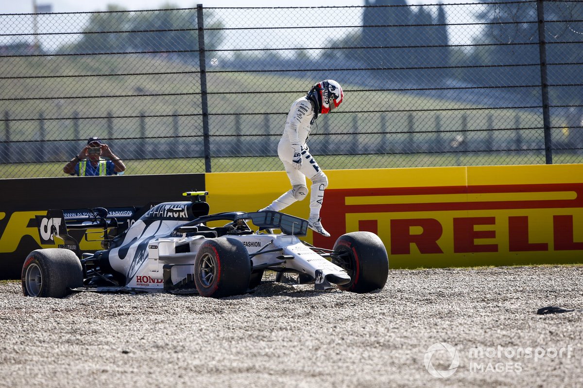 Pierre Gasly, AlphaTauri, climbs out of his car after crashing out on the opening lap