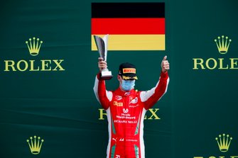 Mick Schumacher, Prema Racing, Race Winner Robert Shwartzman, Prema Racing and Guanyu Zhou, UNI-Virtuosi celebrate on the podium with the champagne