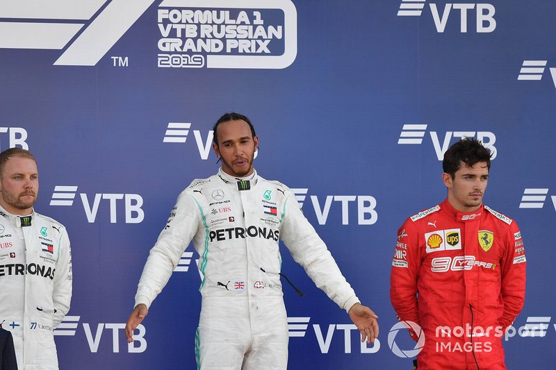 Valtteri Bottas, Mercedes AMG F1, 2nd position, Lewis Hamilton, Mercedes AMG F1, 1st position, and Charles Leclerc, Ferrari, 3rd position, on the podium