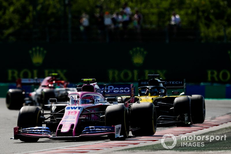 Lance Stroll, Racing Point RP19, leads Daniel Ricciardo, Renault F1 Team R.S.19, and Antonio Giovinazzi, Alfa Romeo Racing C38