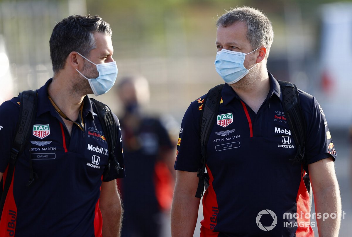 Red Bull team members arrive at the track