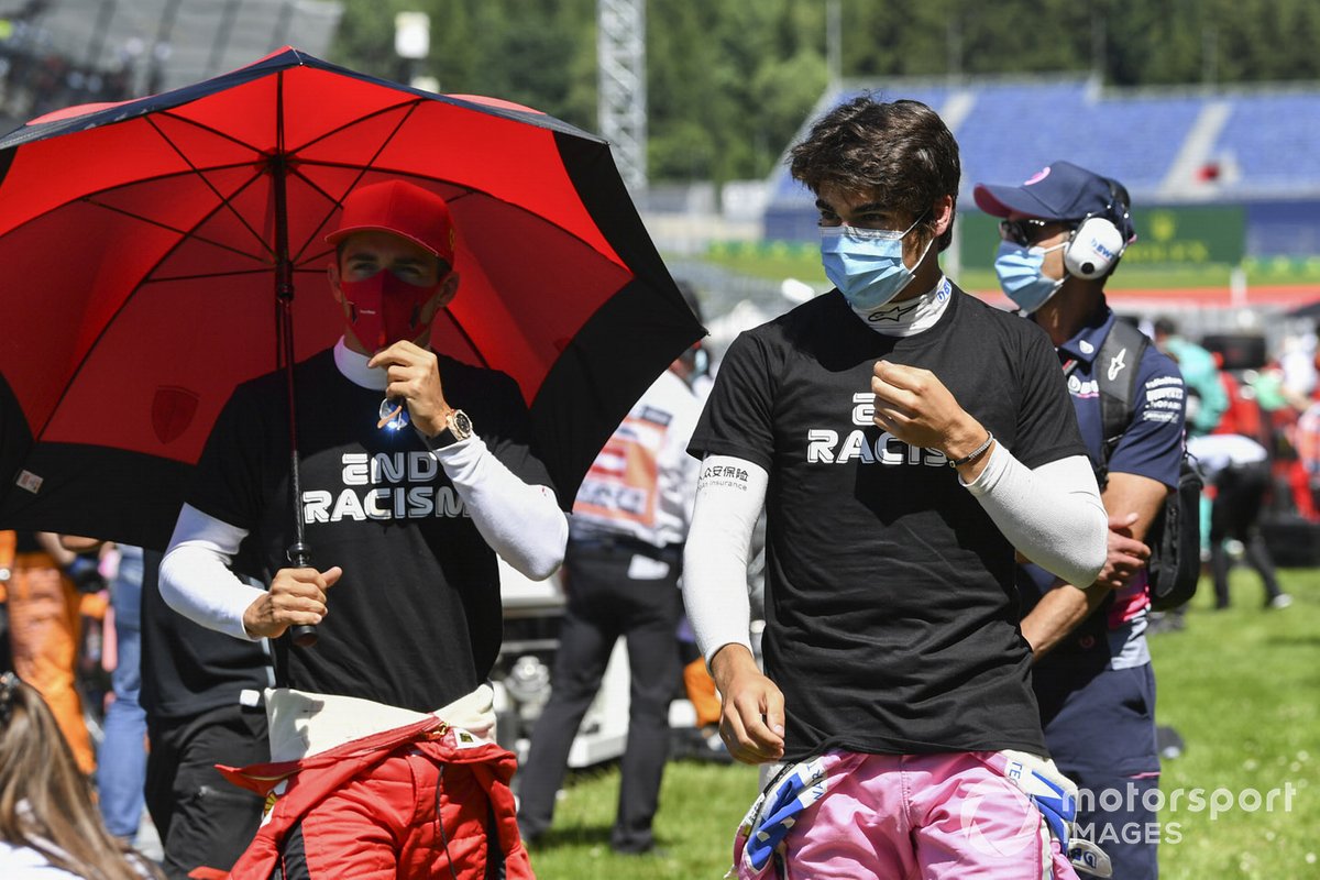 Lance Stroll, Racing Point and Charles Leclerc, Ferrari on the grid
