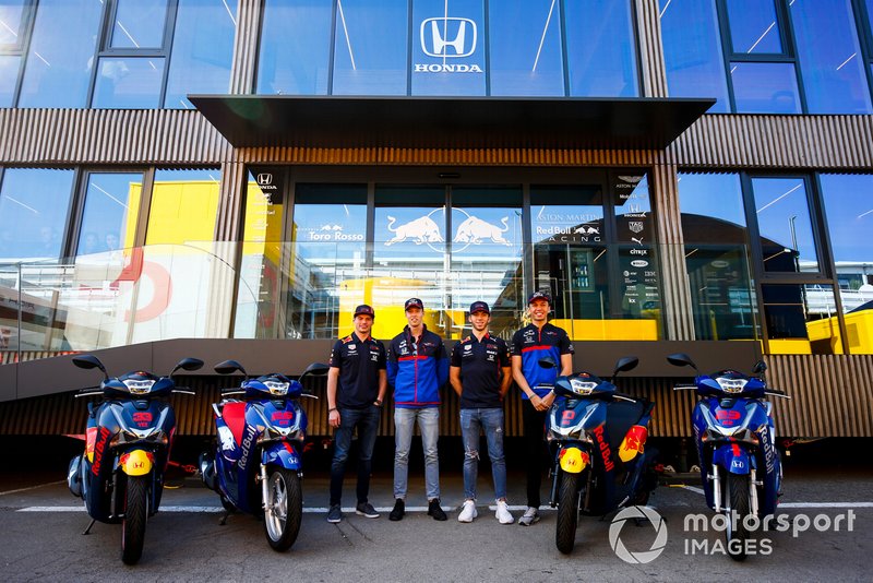 Max Verstappen, Red Bull Racing, Daniil Kvyat, Toro Rosso, Pierre Gasly, Red Bull Racing and Alexander Albon, Toro Rosso with scooters outside the New Toro Rosso Motorhome