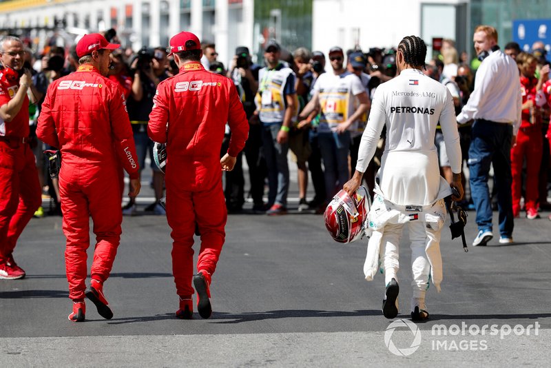 Top three Qualifiers, pole man Sebastian Vettel, Ferrari, third placed Charles Leclerc, Ferrari, and Lewis Hamilton, Mercedes AMG F1, after Qualifying