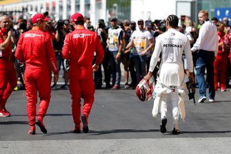 Top three Qualifiers, pole man Sebastian Vettel, Ferrari, third placed Charles Leclerc, Ferrari, and Lewis Hamilton, Mercedes AMG F1, after Qualifying