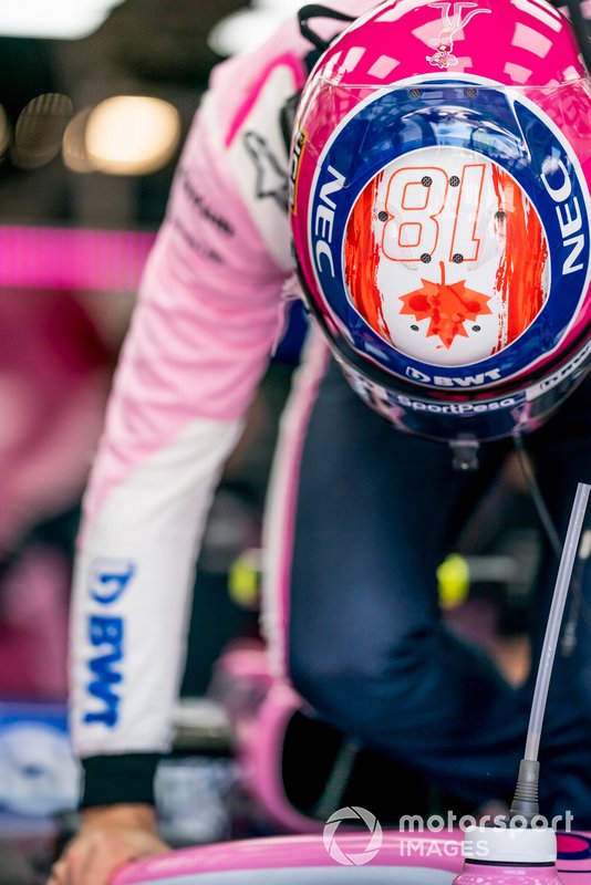 Lance Stroll, Racing Point, climbs into his car