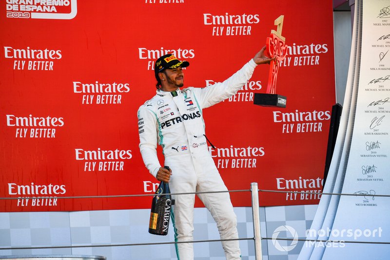 Lewis Hamilton, Mercedes AMG F1, 1st position, on the podium with his trophy and Champagne