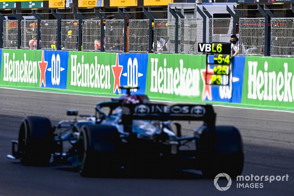 Valtteri Bottas, Mercedes W12, passes his pit board