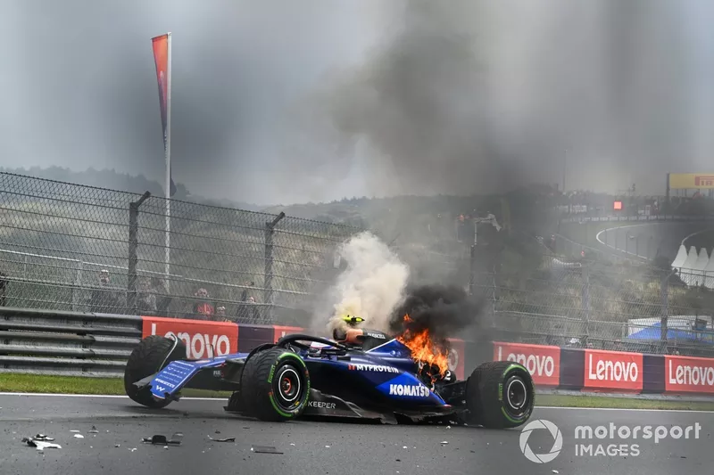 Logan Sargeant, Williams FW46, crashes out of FP3 as fire erupts from the rear of his car