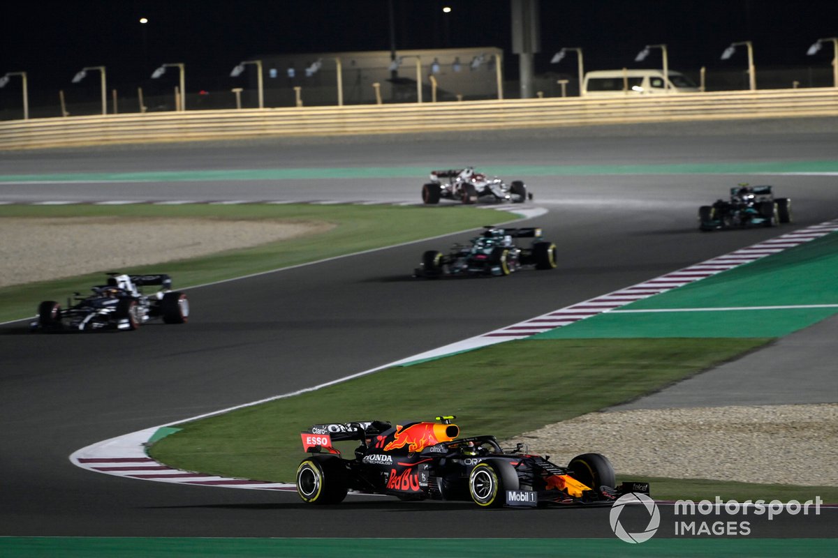 Sergio Perez, Red Bull Racing RB16B, Yuki Tsunoda, AlphaTauri AT02, and Lance Stroll, Aston Martin AMR21