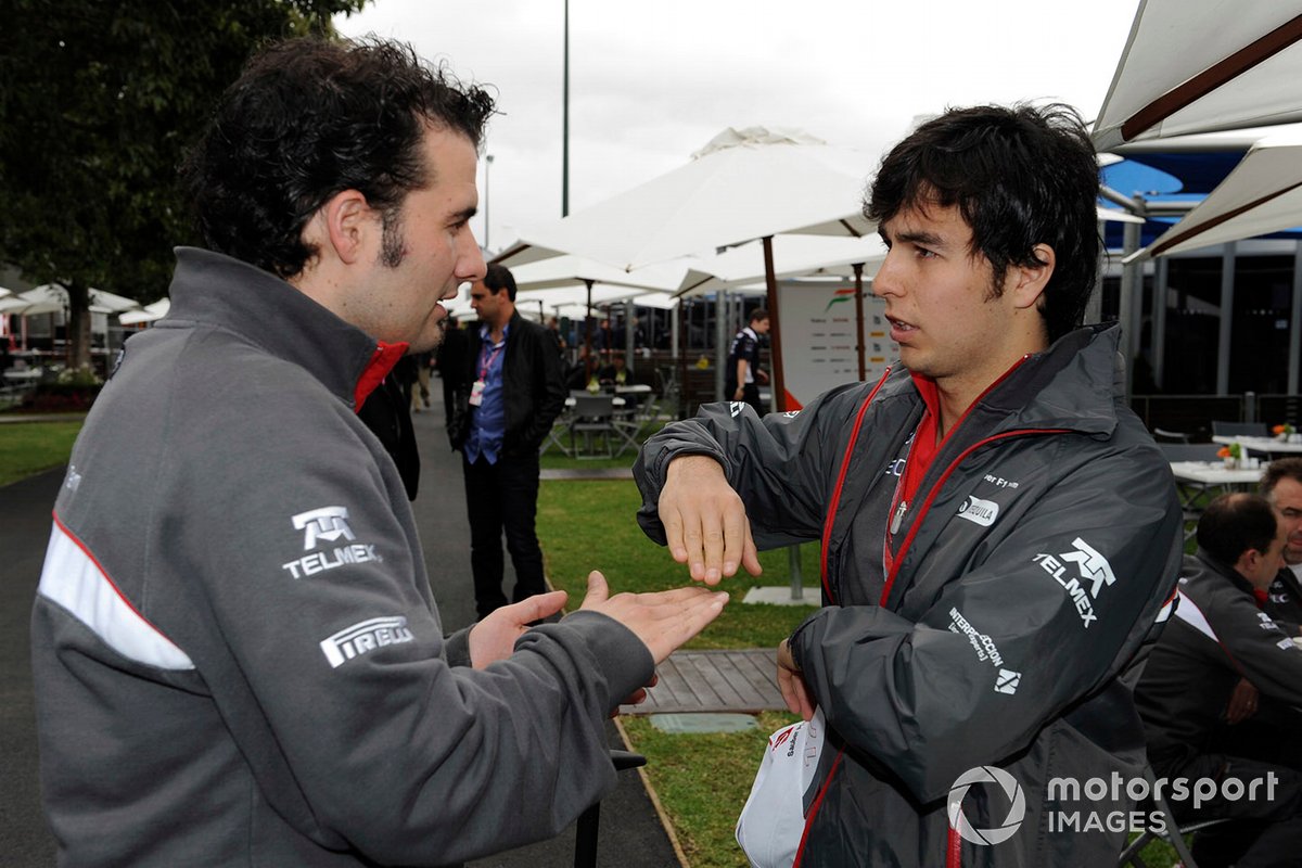 Sergio Perez, Sauber C30 Ferrari, talks with a team mate