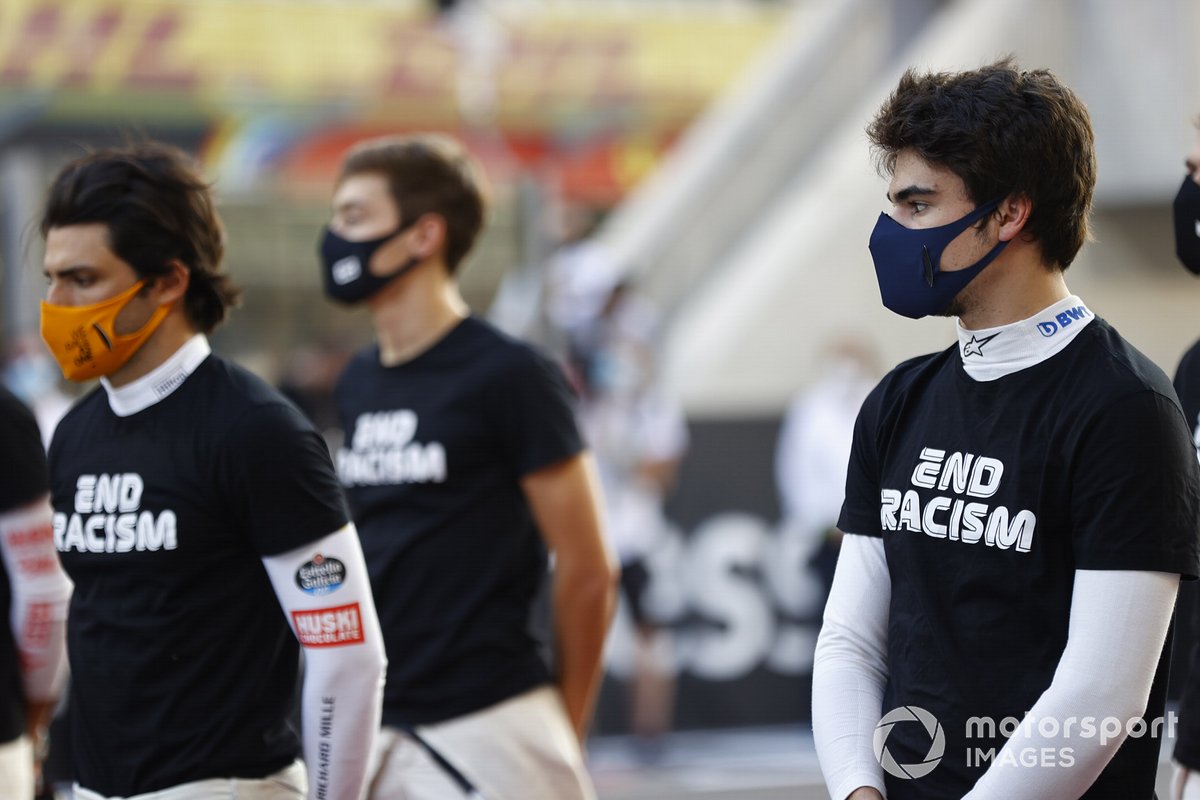 Carlos Sainz Jr., McLaren, and Lance Stroll, Racing Point, on the grid