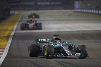 Lewis Hamilton, Mercedes AMG F1 W09 EQ Power+, leads Kevin Magnussen, Haas F1 Team VF-18, and Max Verstappen, Red Bull Racing RB14