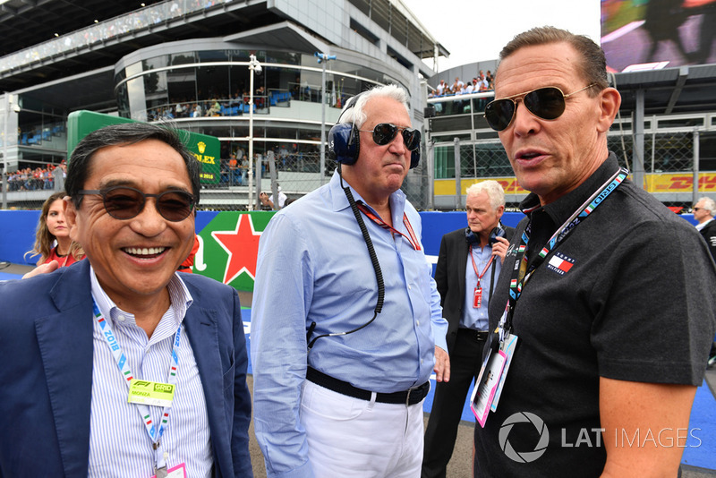 (L to R): Silas Chou, Fashion Tycoon, Lawrence Stroll, Racing Point Force India F1 Team owner and Daniel Greider, CEO Tommy Hilfiger on the grid 