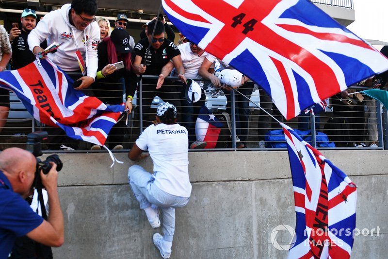 Lewis Hamilton, Mercedes AMG F1, greets fans in the grandstand.