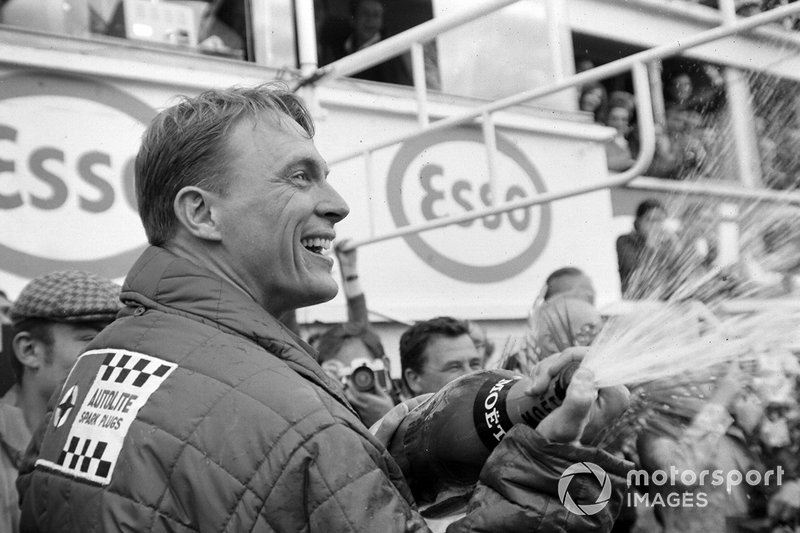 Dan Gurney celebrates his victory