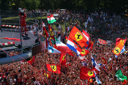 Sebastian Vettel, Ferrari celebrates on the podium, the Ferrari fans and flags