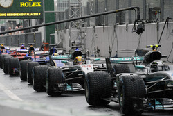 Cars line up in pitlane