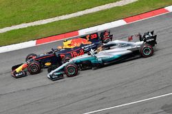 Max Verstappen, Red Bull Racing RB13 passes Lewis Hamilton, Mercedes-Benz F1 W08 for the lead