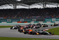 Valtteri Bottas, Mercedes-Benz F1 W08 and Max Verstappen, Red Bull Racing RB13 battle at the start