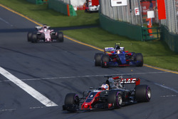 Romain Grosjean, Haas F1 Team VF-17, leads Carlos Sainz Jr., Scuderia Toro Rosso STR12, and Sergio Perez, Force India VJM10